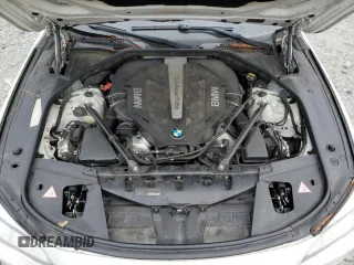 2015 BMW 7 Series 750i z VIN WBAYA8C5XFD825662, wystawiony jako Copart lot #78850474 z przebiegiem 153 080 mil mil oraz Czysty tytuł • Clean title. Historia ofert i sprzedaży dostępna na DreamBid. Obrazek 11.