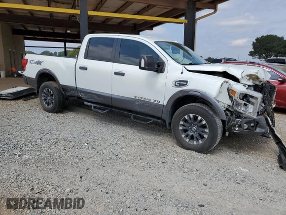 2018 Nissan Titan Platinum Reserve with VIN 1N6BA1F49JN521225, listed as a Copart auction lot 69831004 with 92,536 mi miles and Salvage title. Bid and sale history available at DreamBid. Image 4.