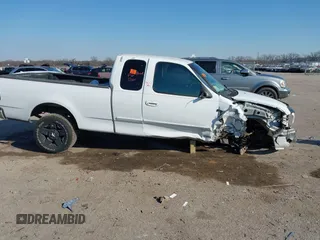 1999 Ford F-150 XL with VIN 1FTRX17L0XKB96416, listed as a IAAI auction lot 41333031 with Not Provided miles. Bid and sale history available at carsss.com. Image 14.