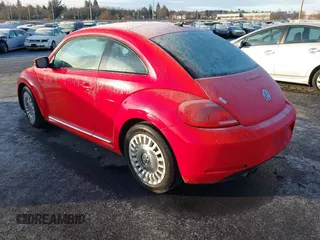 2014 Volkswagen Beetle 2.5L w/Sun with VIN 3VWJP7AT8EM629573, listed as a IAAI auction lot 41479054 with 73,950 mi miles and . Bid and sale history available at DreamBid. Image 3.