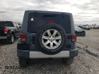 2015 Jeep Wrangler Unlimited Sahara with VIN 1C4BJWEG6FL640316, listed as a Copart auction lot 48024865 with 128,317 mi miles and Salvage Title. Bid and sale history available at carsss.com. Image 6.