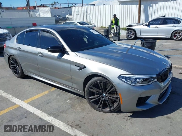 2020 BMW M5 Competition z VIN WBSJF0C05LB448878, wystawiony jako IAAI lot #41796245 z przebiegiem 62 856 mil mil oraz . Historia ofert i sprzedaży dostępna na DreamBid. Obrazek 1.