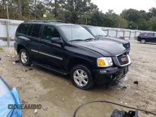 2004 GMC Envoy SLT with VIN 1GKDT13S942279670, listed as a Copart auction lot 73527974 with 120,425 mi miles and Salvage Title. Bid and sale history available at DreamBid. Image 4.