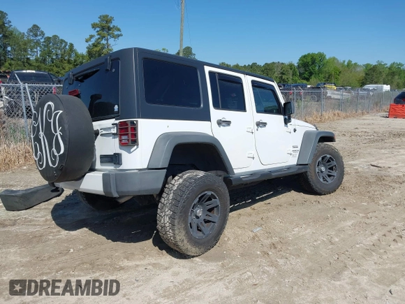 2015 Jeep Wrangler Unlimited Willys Wheeler with VIN 1C4BJWDG0FL546000, listed as a IAAI auction lot 41984566 with 112,742 mi miles and . Bid and sale history available at DreamBid. Image 4.