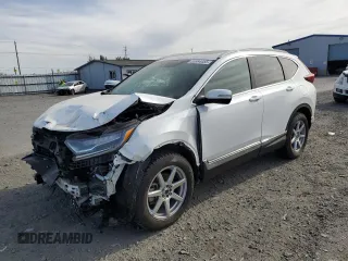 2021 Honda CR-V Touring z VIN 2HKRW2H92MH661297, wystawiony jako Copart lot #55984455 z przebiegiem 23 437 mil mil oraz Szkoda całkowita • Salvage title. Historia ofert i sprzedaży dostępna na DreamBid. Obrazek 1.