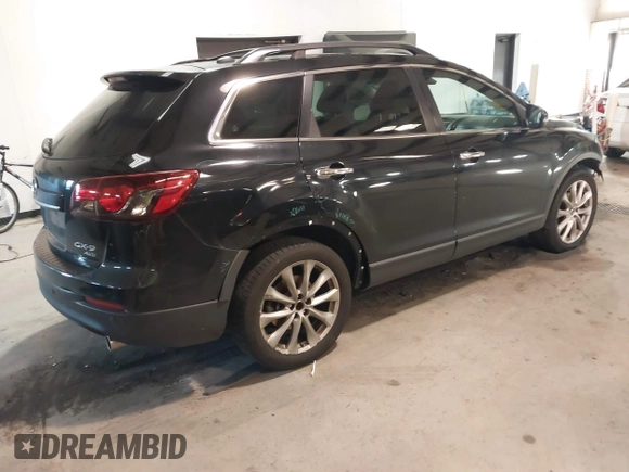 2015 Mazda CX-9 Grand Touring with VIN JM3TB3DV3F0460493, listed as a IAAI auction lot 41053565 with 213,124 mi miles. Bid and sale history available at carsss.com. Image 4.