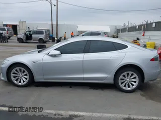 2016 Tesla Model S 90D with VIN 5YJSA1E23GF138925, listed as a IAAI auction lot 42408676 with 48,399 mi miles and . Bid and sale history available at DreamBid. Image 14.