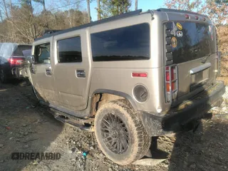2003 Hummer H2 with VIN 5GRGN23U33H110037, listed as a IAAI auction lot 41339142 with 166,795 mi miles. Bid and sale history available at carsss.com. Image 3.