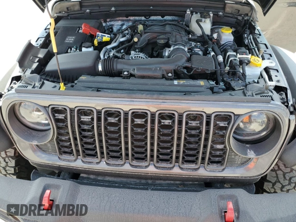 2024 Jeep Wrangler Rubicon z VIN 1C4PJXFG6RW261748, wystawiony jako Copart lot #44166485 z przebiegiem 7 911 mil mil oraz Szkoda całkowita • Salvage title. Historia ofert i sprzedaży dostępna na DreamBid. Obrazek 11.