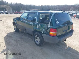 1997 Jeep Grand Cherokee Laredo with VIN 1J4GZ58S2VC595442, listed as a IAAI auction lot 41772133 with 229,764 mi miles. Bid and sale history available at carsss.com. Image 3.