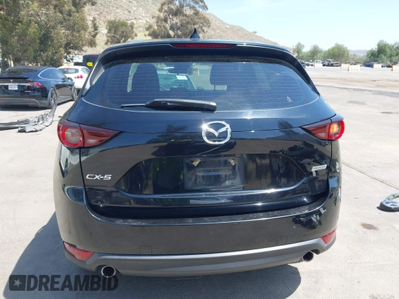 2019 Mazda CX-5 Sport with VIN JM3KFABM7K1509987, listed as a IAAI auction lot 42062804 with 50,898 mi miles and . Bid and sale history available at DreamBid. Image 17.