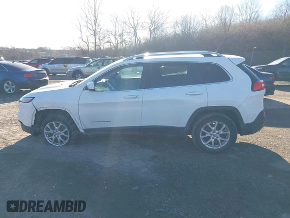2015 Jeep Cherokee Latitude with VIN 1C4PJMCB3FW734573, listed as a IAAI auction lot 41825561 with 141,250 mi miles. Bid and sale history available at carsss.com. Image 15.