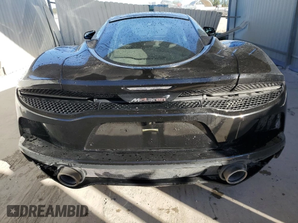 2022 McLaren GT z VIN SBM22GCA4NW001602, wystawiony jako Copart lot #83270334 z przebiegiem 33 668 mil mil oraz Tytuł czysty. Historia ofert i sprzedaży dostępna na DreamBid. Obrazek 6.