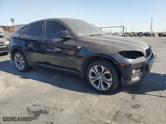 2014 BMW X6 xDrive35i with VIN 5UXFG2C53E0C43500, listed as a Copart auction lot 77193684 with 124,454 mi miles and Clean Title. Bid and sale history available at carsss.com. Image 4.