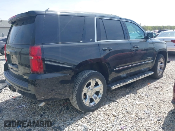 2018 Chevrolet Tahoe LT with VIN 1GNSKBKC7JR245565, listed as a IAAI auction lot 42097400 with 123,709 mi miles and . Bid and sale history available at DreamBid. Image 4.
