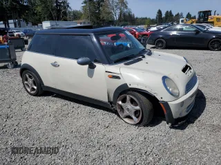 2006 MINI Hardtop with VIN WMWRC33586TJ77908, listed as a Copart auction lot 55095525 with 143,810 mi miles and Salvage title. Bid and sale history available at DreamBid. Image 4.