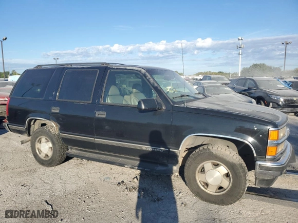 1999 Chevrolet Tahoe Z71 with VIN 1GNEK13R6XJ411348, listed as a Copart auction lot 71179204 with 162,752 mi miles and Salvage Title. Bid and sale history available at carsss.com. Image 4.
