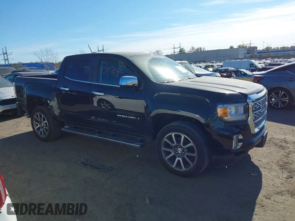 2021 GMC Canyon 4WD Denali z VIN 1GTG6EEN9M1240596, wystawiony jako IAAI lot #40760124 z przebiegiem 52 985 mil mil oraz . Historia ofert i sprzedaży dostępna na DreamBid. Obrazek 13.