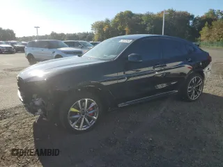 2021 BMW X4 M40i with VIN 5UX2V5C05M9H59295, listed as a Copart auction lot 71312963 with 31,050 mi miles. Bid and sale history available at carsss.com. Image 1.