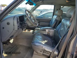 1999 GMC Denali z VIN 1GKEK13R4XR918005, wystawiony jako Copart lot #74964184 z przebiegiem 206 584 mil mil oraz Nie do naprawy. Historia ofert i sprzedaży dostępna na DreamBid. Obrazek 7.