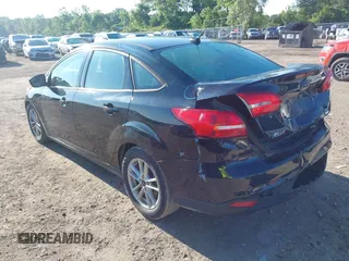 2018 Ford Focus SE with VIN 1FADP3FEXJL286396, listed as a IAAI auction lot 42634912 with 73,769 mi miles and . Bid and sale history available at DreamBid. Image 3.