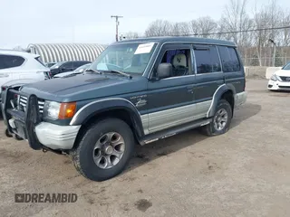 1995 Mitsubishi Montero z VIN JA4MR41H7SJ010597, wystawiony jako IAAI lot #41610885 z przebiegiem 162 406 mil mil oraz . Historia ofert i sprzedaży dostępna na DreamBid. Obrazek 2.