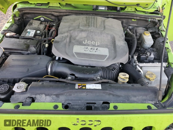 2013 Jeep Wrangler Rubicon 10th Anniversary with VIN 1C4BJWCG0DL506174, listed as a Copart auction lot 85300514 with 133,974 mi miles and Salvage Title. Bid and sale history available at DreamBid. Image 12.