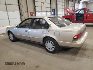 1990 Nissan Maxima z VIN JN1HJ01PXLT401797, wystawiony jako Copart lot #47868945 z przebiegiem Nie podano mil oraz Szkody całkowita. Historia ofert i sprzedaży dostępna na DreamBid. Obrazek 2.