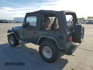 2002 Jeep Wrangler SE z VIN 1J4FA29P72P711802, wystawiony jako Copart lot #52640405 z przebiegiem 107 046 mil mil oraz Czysty tytuł • Clean title. Historia ofert i sprzedaży dostępna na DreamBid. Obrazek 2.