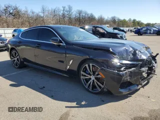2020 BMW 8 Series M850i with VIN WBAGV8C02LCE34594, listed as a Copart auction lot 50389675 with 37,279 mi miles and Salvage title. Bid and sale history available at DreamBid. Image 4.