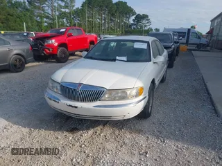 1998 Lincoln Continental z VIN 1LNLM97V1WY602564, wystawiony jako IAAI lot #42333637 z przebiegiem 142 234 mil mil oraz . Historia ofert i sprzedaży dostępna na DreamBid. Obrazek 6.