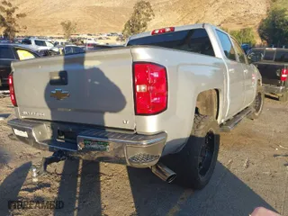 2014 Chevrolet Silverado 1500 LT with VIN 3GCPCREC1EG160887, listed as a IAAI auction lot 41399320 with 157,884 mi miles. Bid and sale history available at carsss.com. Image 4.