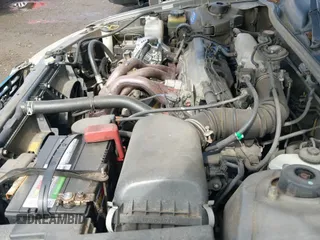 2000 Toyota Camry CE z VIN JT2BG22K8Y0410919, wystawiony jako IAAI lot #43198945 z przebiegiem 183 150 mil mil oraz . Historia ofert i sprzedaży dostępna na DreamBid. Obrazek 19.