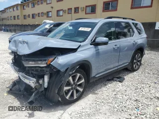 2023 Honda Pilot Touring with VIN 5FNYG2H75PB011423, listed as a Copart auction lot 60784185 with 8,214 mi miles and Salvage title. Bid and sale history available at DreamBid. Image 1.
