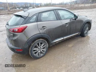 2016 Mazda CX-3 Grand Touring with VIN JM1DKBD77G0107328, listed as a IAAI auction lot 41682949 with 156,935 mi miles. Bid and sale history available at carsss.com. Image 4.