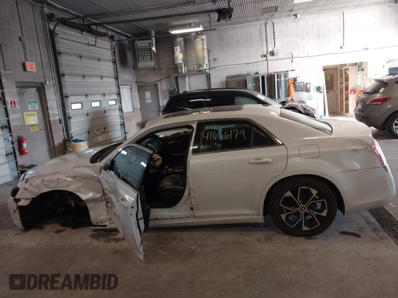 2014 Chrysler 300 with VIN 2C3CCAAGXEH217715, listed as a IAAI auction lot 41666179 with 145,744 mi miles and . Bid and sale history available at DreamBid. Image 14.