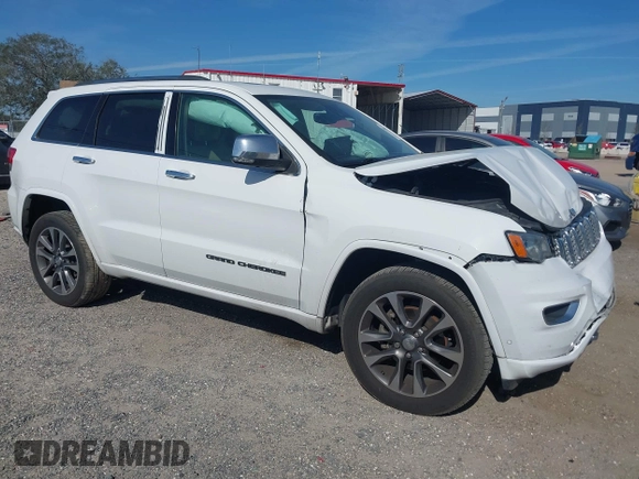 2017 Jeep Grand Cherokee Overland z VIN 1C4RJECG5HC959981, wystawiony jako IAAI lot #41638958 z przebiegiem 102 122 mil mil oraz . Historia ofert i sprzedaży dostępna na DreamBid. Obrazek 1.