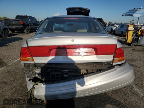 1999 Saturn SL with VIN 1G8ZK5274XZ367394, listed as a Copart auction lot 63863795 with 73,197 mi miles and Salvage title. Bid and sale history available at DreamBid. Image 6.