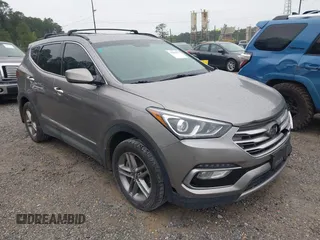 2017 Hyundai Santa Fe 2.4L z VIN 5XYZU3LB8HG421397, wystawiony jako IAAI lot #41961915 z przebiegiem 102 594 mil mil oraz . Historia ofert i sprzedaży dostępna na DreamBid. Obrazek 1.
