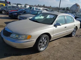 2002 Lincoln Continental with VIN 1LNHM97V22Y672557, listed as a IAAI auction lot 41442390 with 179,198 mi miles. Bid and sale history available at carsss.com. Image 2.