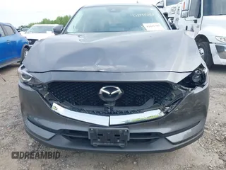 2017 Mazda CX-5 Touring z VIN JM3KFBCL4H0178747, wystawiony jako IAAI lot #42041380 z przebiegiem 112 083 mil mil oraz . Historia ofert i sprzedaży dostępna na DreamBid. Obrazek 6.