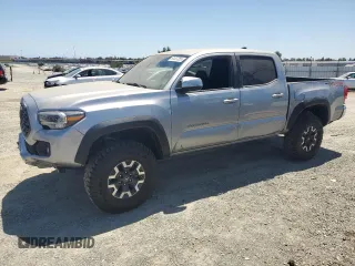2021 Toyota Tacoma SR with VIN 3TMCZ5AN8MM382064, listed as a Copart auction lot 61227355 with 67,724 mi miles and Salvage title. Bid and sale history available at DreamBid. Image 1.