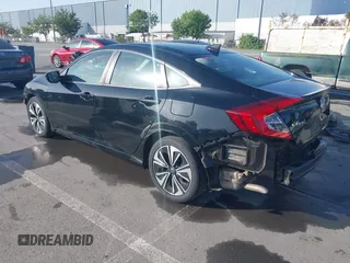 2016 Honda Civic Sedan EX-L with VIN 19XFC1F73GE215112, listed as a IAAI auction lot 42093218 with 67,233 mi miles. Bid and sale history available at carsss.com. Image 3.