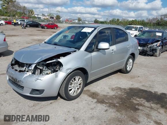 2012 Suzuki SX4 LE with VIN JS2YC5A30C6304324, listed as a IAAI auction lot 41585174 with 111,471 mi miles. Bid and sale history available at carsss.com. Image 2.