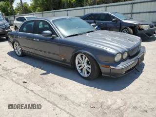 2004 Jaguar XJ with VIN SAJWA73B64TG18784, listed as a Copart auction lot 81254734 with 0 mi miles and Clean Title. Bid and sale history available at carsss.com. Image 4.