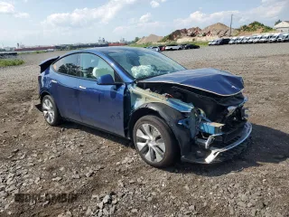 2024 Tesla Model Y Long Range with VIN 7SAYGAEEXRF983702, listed as a Copart auction lot 61536565 with Not provided miles and Salvage title. Bid and sale history available at DreamBid. Image 4.