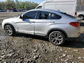 2017 BMW X4 xDrive28i with VIN 5UXXW3C52H0T77719, listed as a Copart auction lot 52393155 with 184,664 mi miles and Salvage title. Bid and sale history available at DreamBid. Image 2.