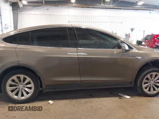 2016 Tesla Model X 70D with VIN 5YJXCBE27GF004974, listed as a IAAI auction lot 41630556 with 167,709 mi miles. Bid and sale history available at carsss.com. Image 14.