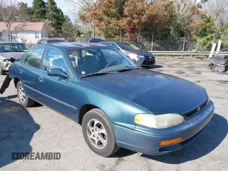 1996 Toyota Camry DX with VIN 4T1BG12K1TU688639, listed as a IAAI auction lot 41883160 with 264,542 mi miles. Bid and sale history available at carsss.com. Image 1.