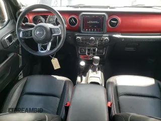 2018 Jeep Wrangler Unlimited Rubicon with VIN 1C4HJXFG1JW261472, listed as a Copart auction lot 63259345 with 60,457 mi miles and Salvage title. Bid and sale history available at DreamBid. Image 8.
